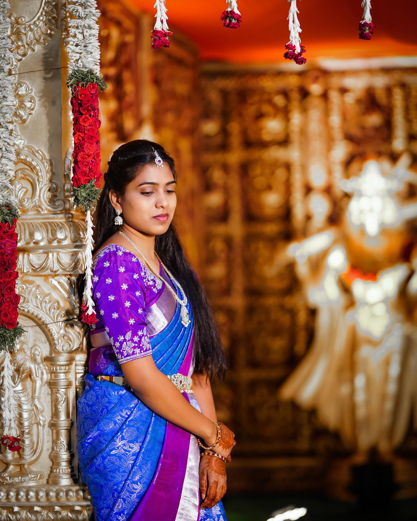 A softly lit bridal portrait in blue and purple